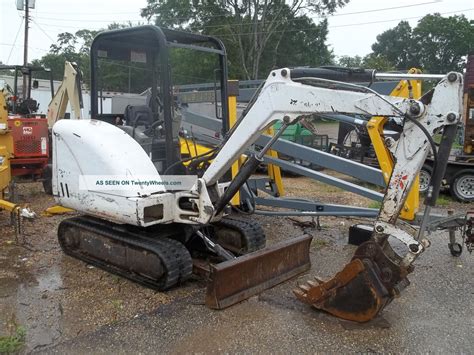 Building a woods road with small equipment. Bobcat 325 mini